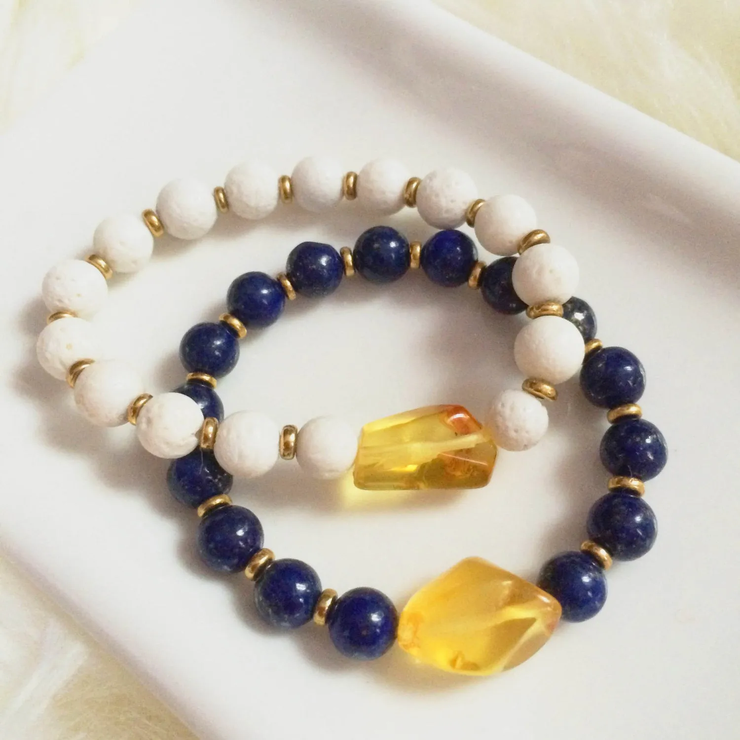 Amber, white coral & brass bracelet